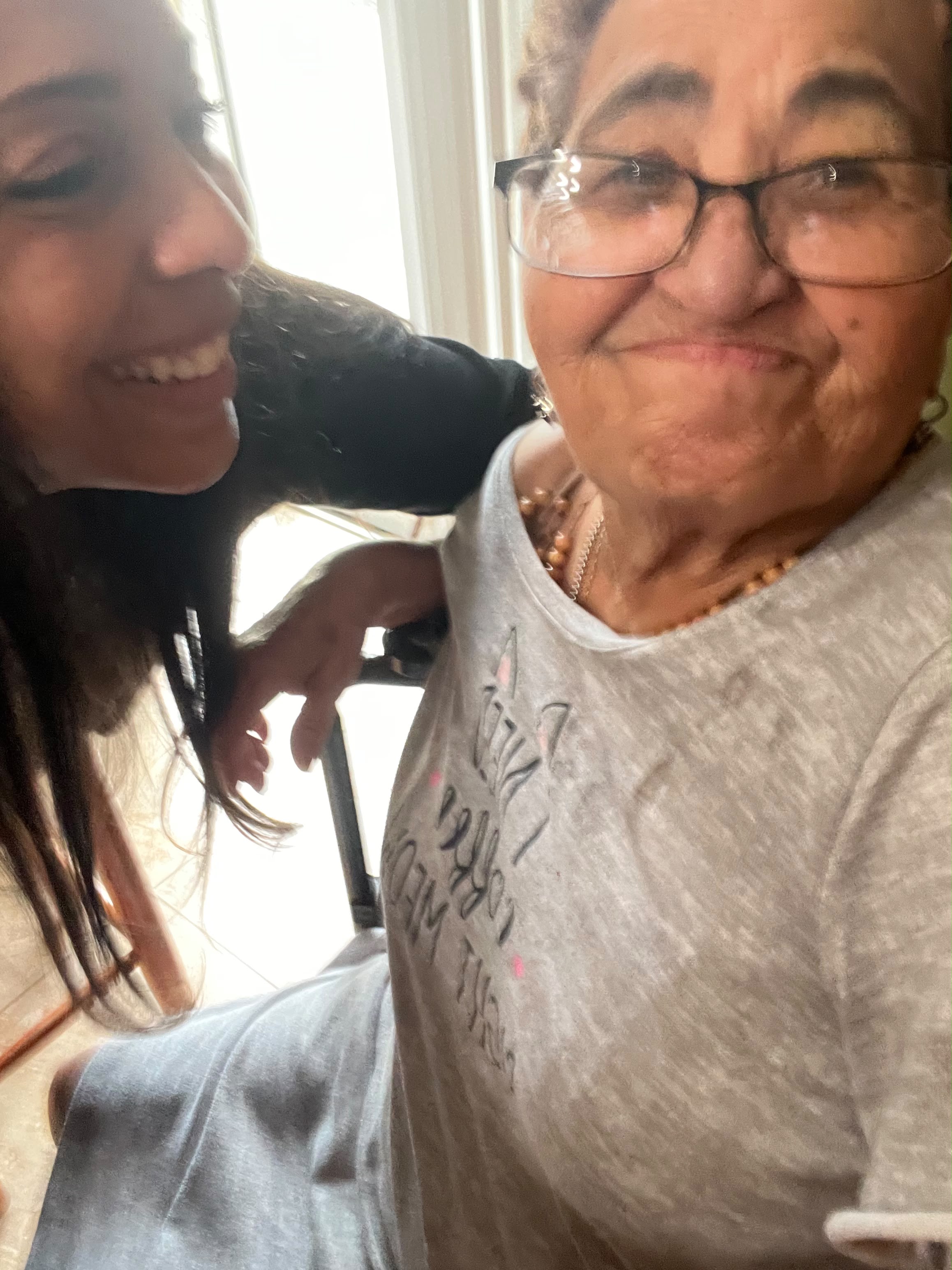 A daughter and mother sharing a smiling moment together